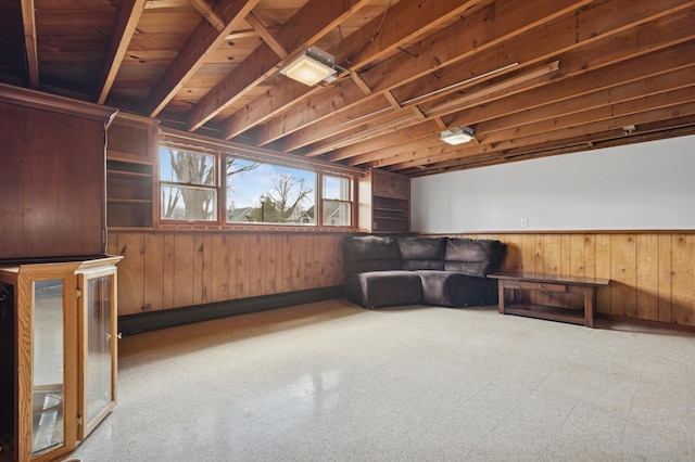 sitting room with wood walls and a wainscoted wall