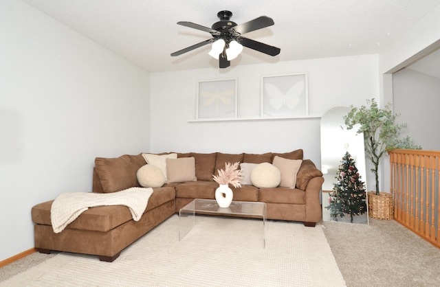 living room featuring light carpet and ceiling fan