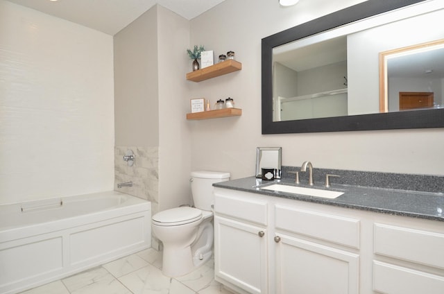 bathroom featuring a bathing tub, vanity, and toilet