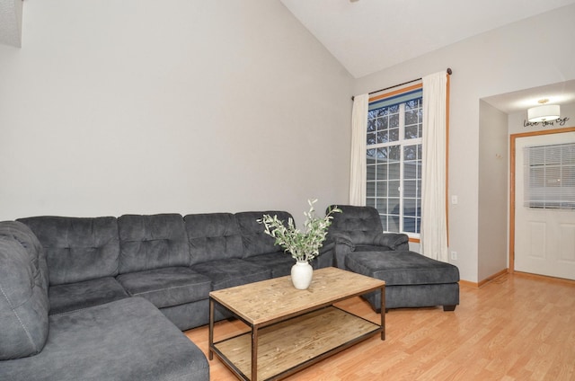 living room featuring hardwood / wood-style floors and vaulted ceiling