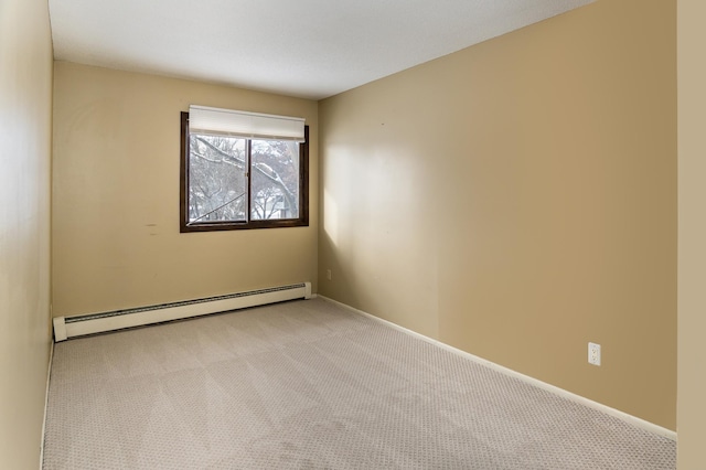 unfurnished room featuring light colored carpet and a baseboard heating unit