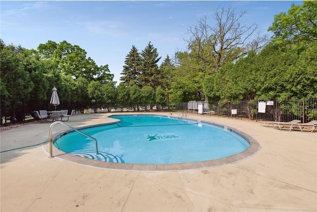 view of swimming pool with a patio