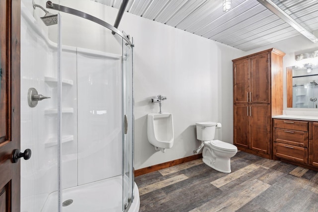 bathroom featuring hardwood / wood-style flooring, vanity, toilet, and an enclosed shower