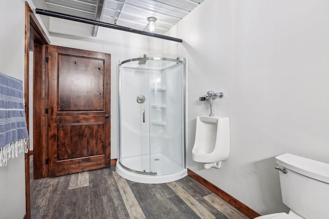 9200 Nike Road 31 & 47, Minnetrista, MN 55359 - full bathroom with wood finished floors, a stall shower, toilet, and baseboards