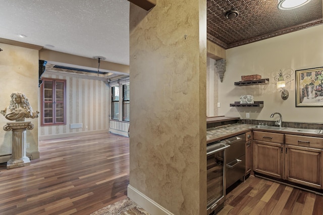 kitchen with wine cooler, crown molding, and dark wood-type flooring