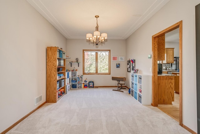 misc room with light carpet and a notable chandelier