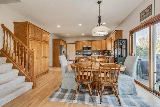 dining space featuring light hardwood / wood-style floors