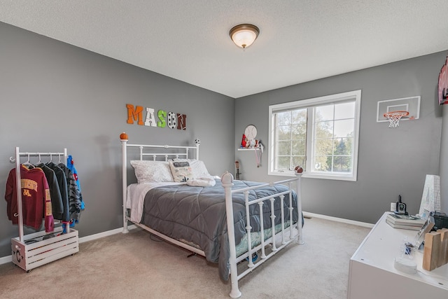 carpeted bedroom with a textured ceiling