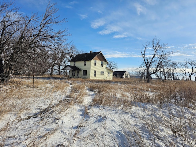 view of snow covered property