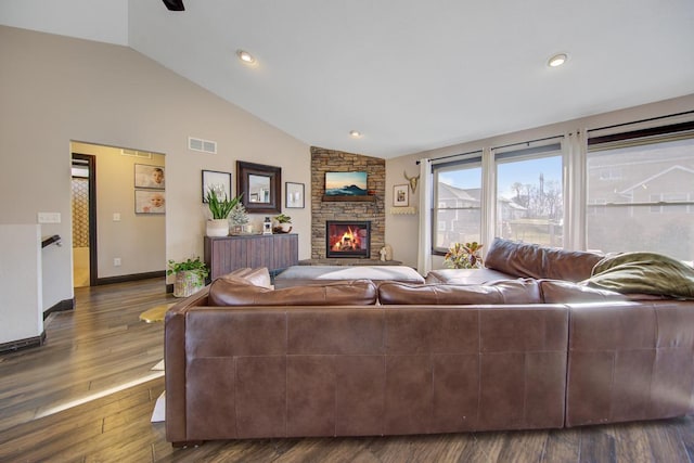 living room featuring a fireplace, radiator heating unit, dark hardwood / wood-style floors, and lofted ceiling