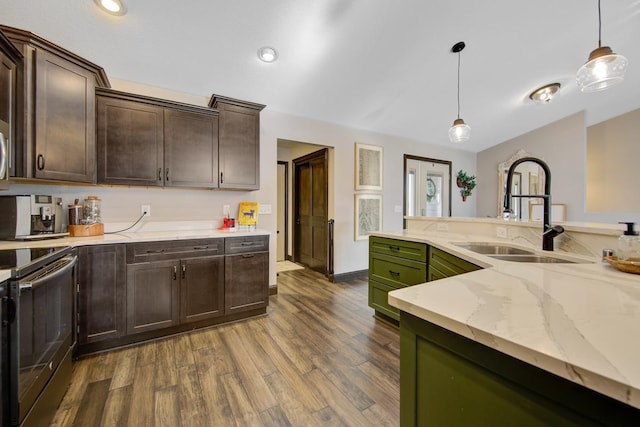 kitchen featuring decorative light fixtures, dark brown cabinetry, stainless steel electric range oven, and sink