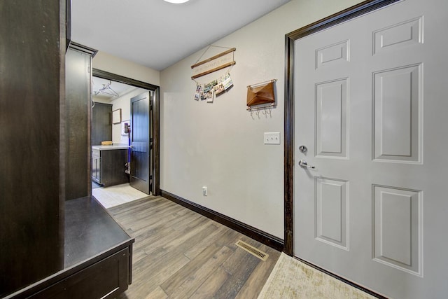 corridor featuring light hardwood / wood-style flooring