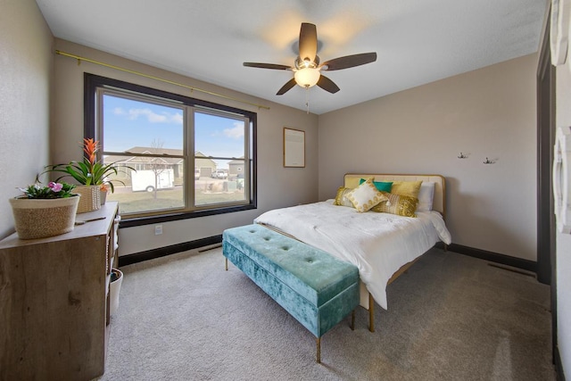 bedroom with ceiling fan and light colored carpet