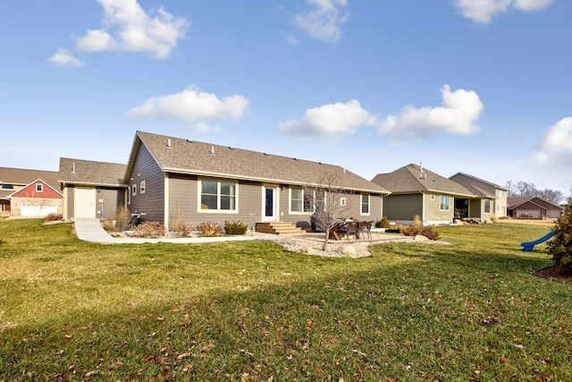 back of house with a lawn and a patio area