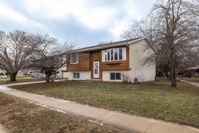 split foyer home with a front lawn