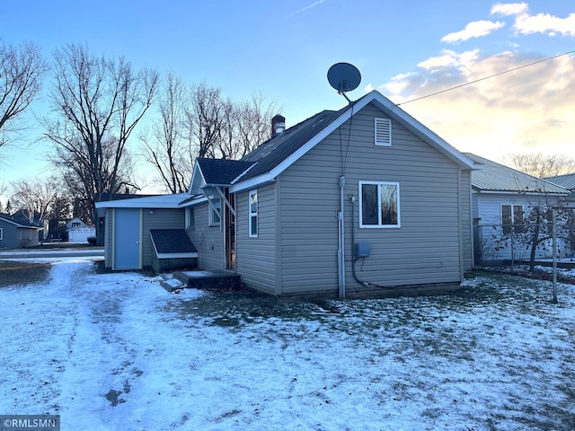 view of snow covered house