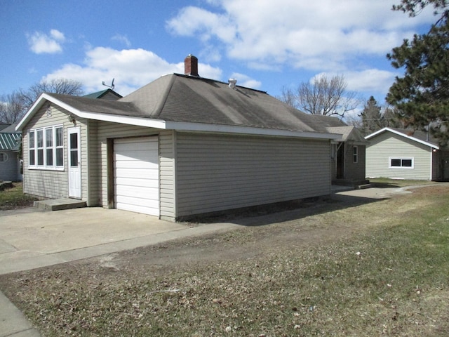 view of side of home with a garage