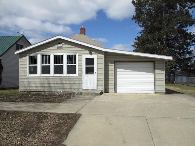 single story home featuring a garage