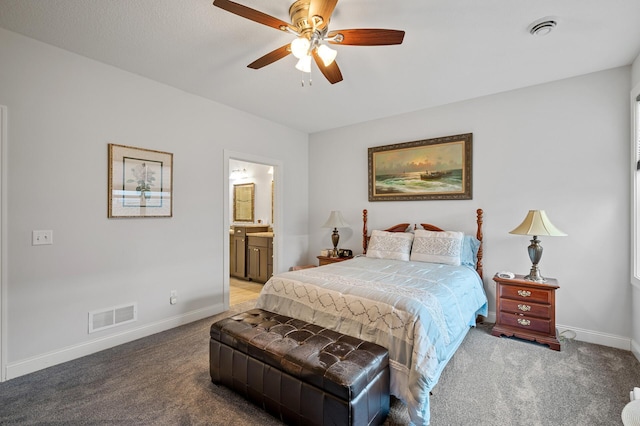 bedroom with connected bathroom, ceiling fan, and carpet floors