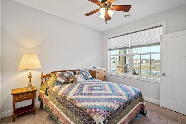 carpeted bedroom with ceiling fan