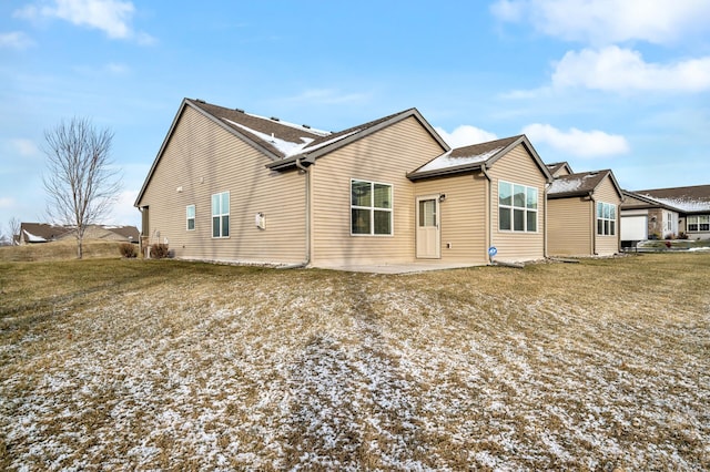 back of house featuring a patio area and a yard