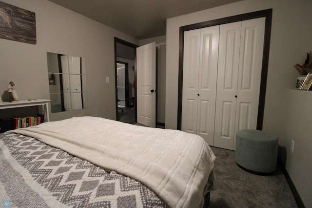 bedroom with dark carpet and a closet