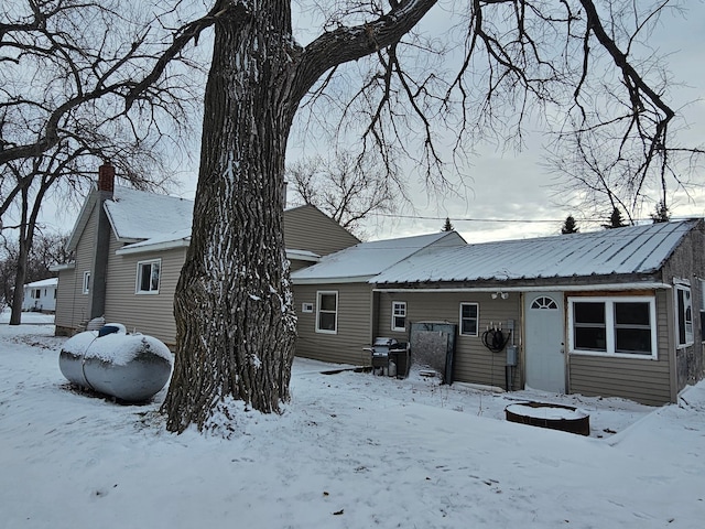 view of snow covered house