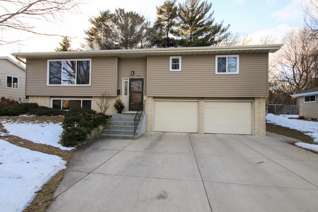 bi-level home featuring a garage