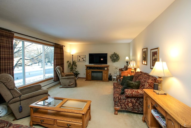 living room featuring plenty of natural light, light colored carpet, and a baseboard heating unit