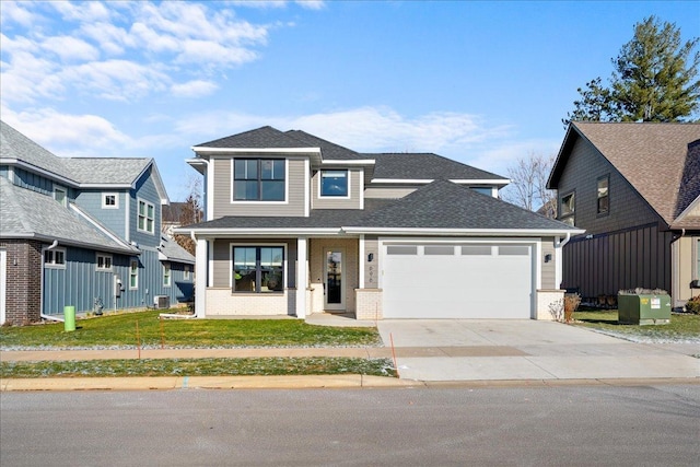 view of front facade featuring a garage, a porch, and a front lawn