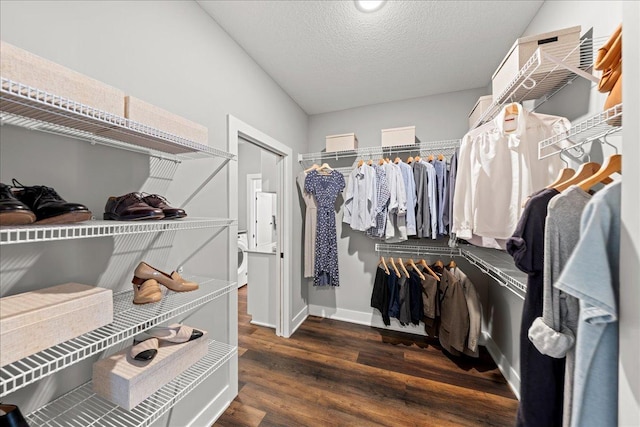 walk in closet featuring dark wood-type flooring