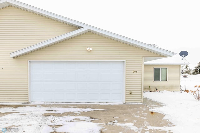 view of snow covered garage