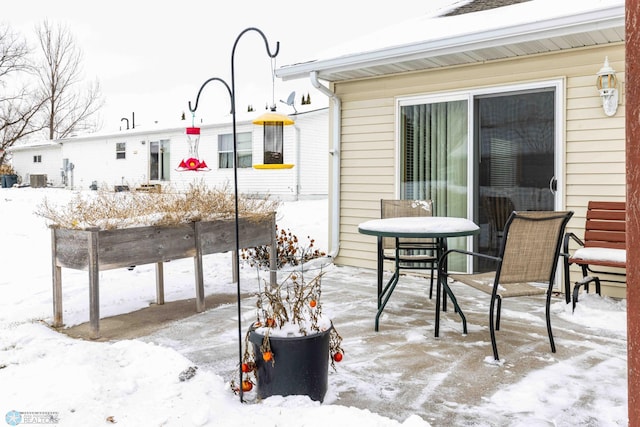 view of snow covered patio