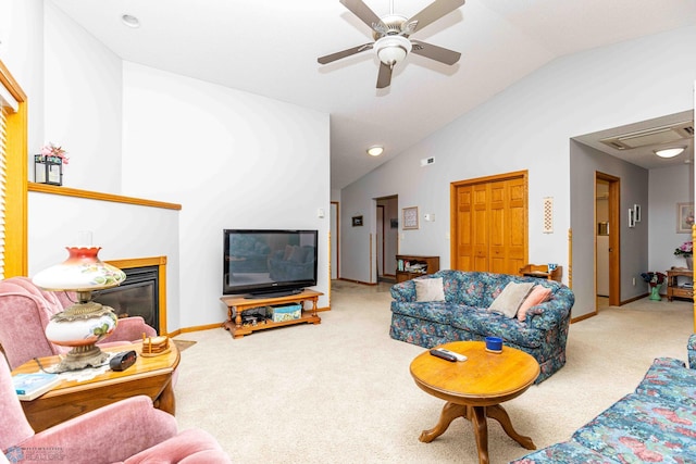 carpeted living room featuring ceiling fan and lofted ceiling