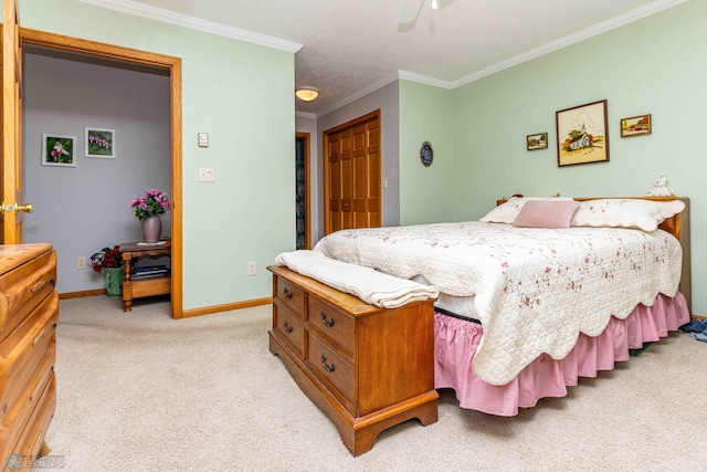 bedroom with crown molding, ceiling fan, a closet, and light carpet