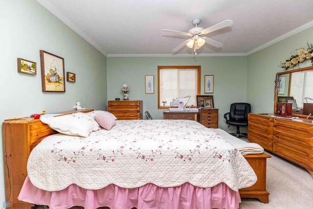 carpeted bedroom with ceiling fan and ornamental molding