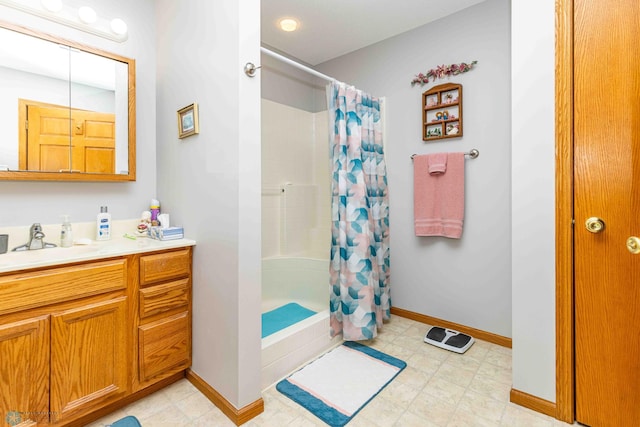 bathroom featuring vanity and walk in shower