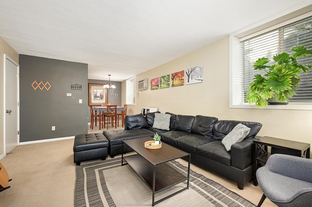 5136 Hiawatha Ave Unit 002, Minneapolis, MN 55417 - living area featuring baseboards, an AC wall unit, light colored carpet, and a notable chandelier