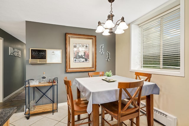 5136 Hiawatha Ave Unit 002, Minneapolis, MN 55417 - dining area featuring light tile patterned flooring, baseboards, a chandelier, and a baseboard radiator