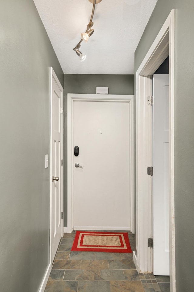 5136 Hiawatha Ave Unit 002, Minneapolis, MN 55417 - doorway to outside with baseboards and stone finish flooring