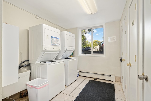 5136 Hiawatha Ave Unit 002, Minneapolis, MN 55417 - clothes washing area with light tile patterned flooring, laundry area, a sink, baseboard heating, and stacked washing maching and dryer