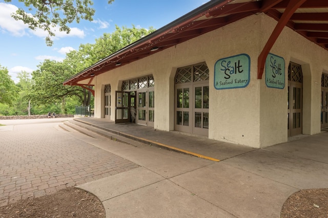 5136 Hiawatha Ave Unit 002, Minneapolis, MN 55417 - exterior space featuring a patio area, stucco siding, and french doors