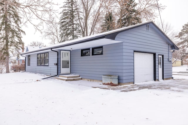 single story home with a garage