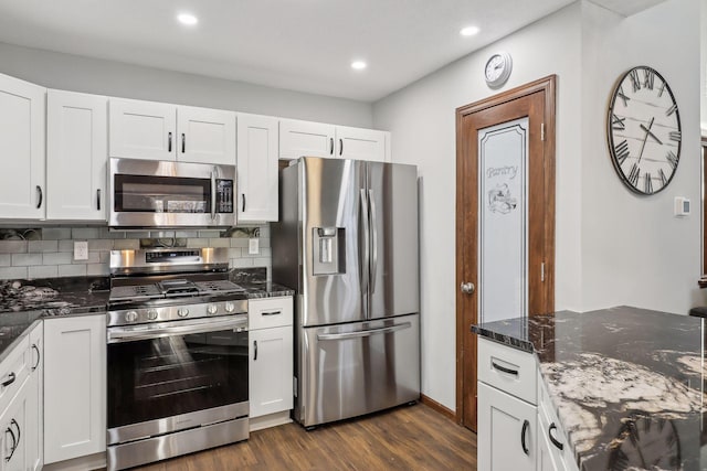 kitchen featuring white cabinets, dark hardwood / wood-style floors, and appliances with stainless steel finishes