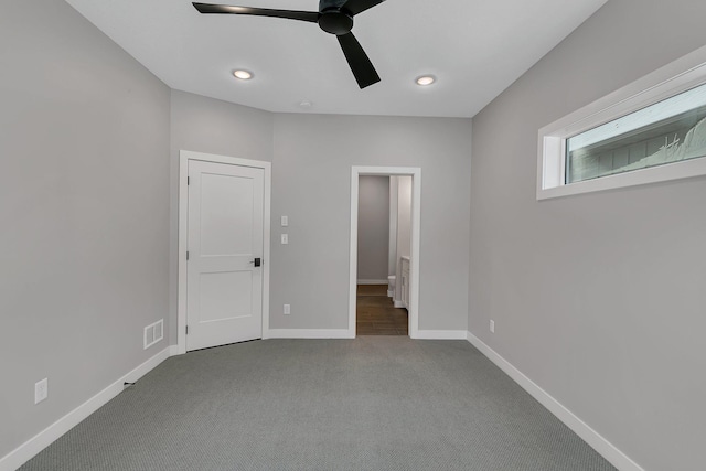 unfurnished bedroom featuring carpet floors and ceiling fan