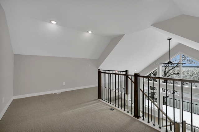 bonus room featuring carpet flooring, ceiling fan, and lofted ceiling