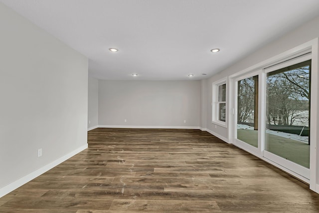 unfurnished room featuring dark wood-type flooring