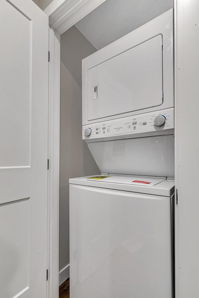 laundry room featuring stacked washing maching and dryer