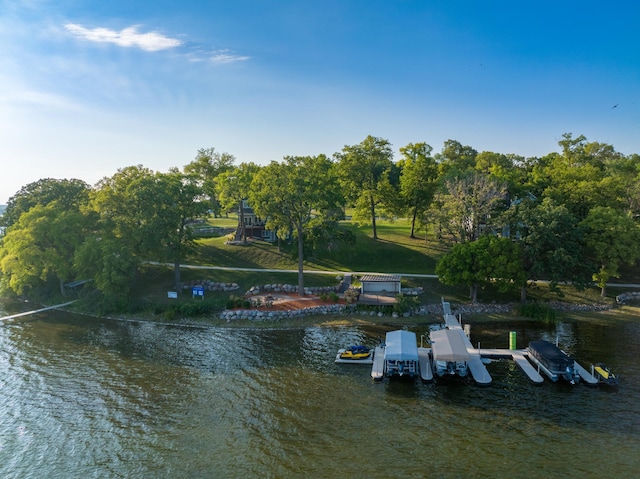 view of dock featuring a yard and a water view