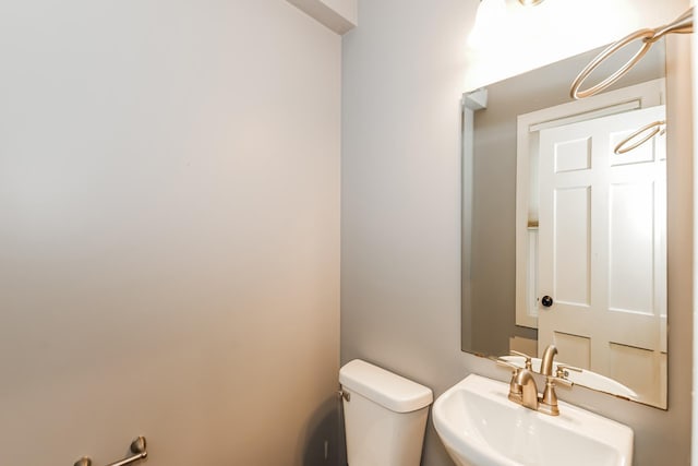 bathroom with toilet and sink